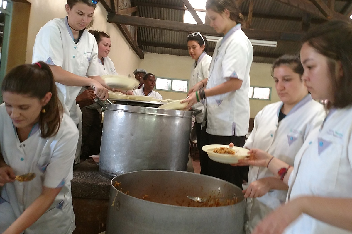Students serving meals at the St. Martin's School and Feeding program in the Kibagare slum near Nairobi.
