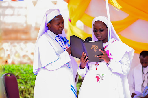 ASEC sisters give a reading of the Holy Bible at an SLDI graduation held in Uganda in October of 2018.