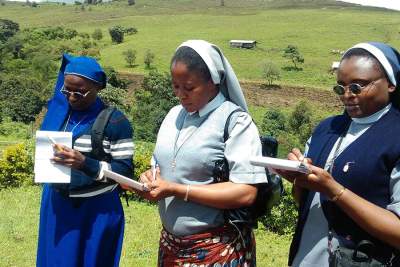 Sisters Theresia, Felicia and Evelyn busy taking notes during a site visit to the SHUMAS Biofarm