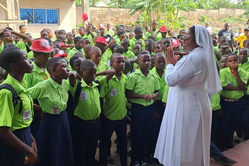 HESA alum, Sr. Vera Bi Kiekiseeh Otia, HHCJ, addresses students at St. Pius X Comprehensive and Technical College in Cameroon.