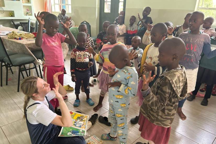 Student engages in expressive art therapy with children at the Dorothea Rescue Center