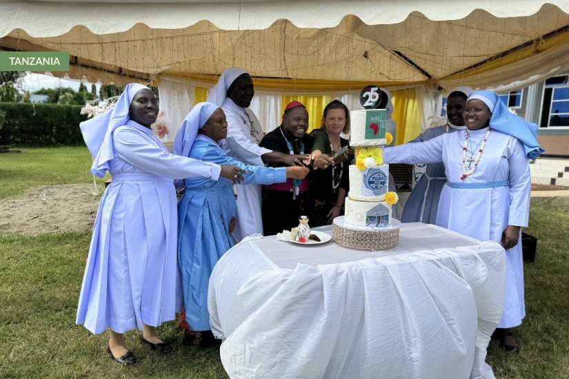 Catholic sisters in Tanzania join ASEC staff and partners to cut a Jubilee cake during the first celebration of ASEC’s 25th Anniversary in Morogoro.