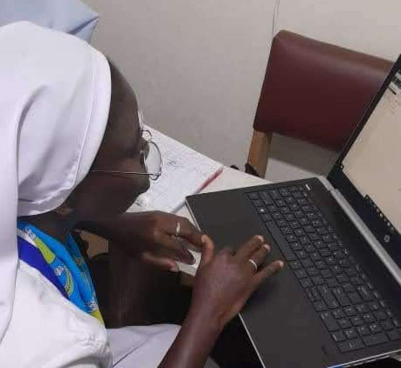 Sr. Mavis Ackaah Mensah, SIJ works on accounting projects in her healthcare ministry.