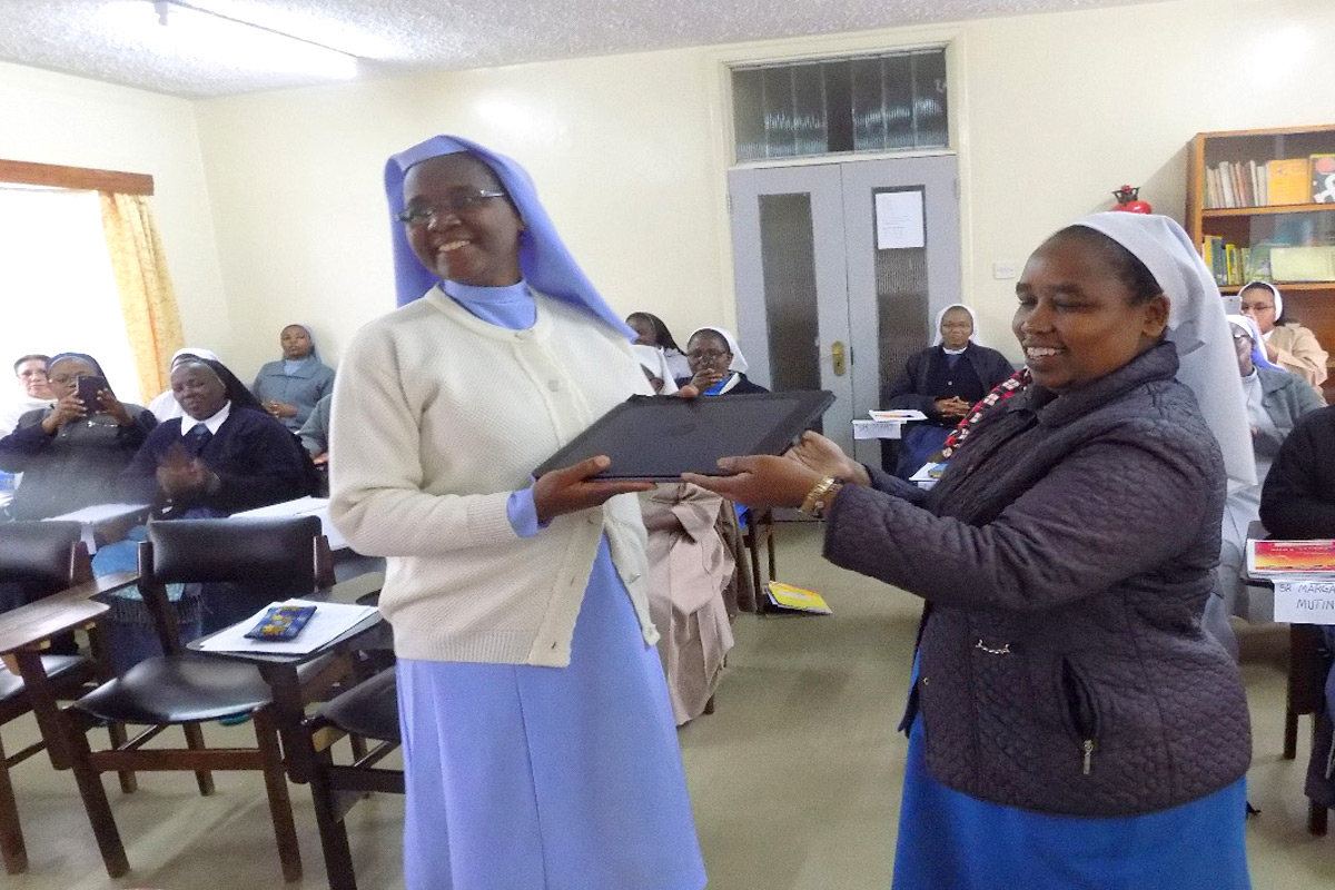 During the Kenya SLDI Administration I Workshop in May 2017, Sr. Adelaide receives her laptop from Sr. Lina, the ASEC Regional Director East & Central Africa.