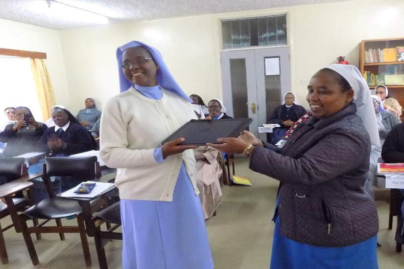 During the Kenya SLDI Administration I Workshop in May 2017, Sr. Adelaide receives her laptop from Sr. Lina, the ASEC Regional Director East & Central Africa.