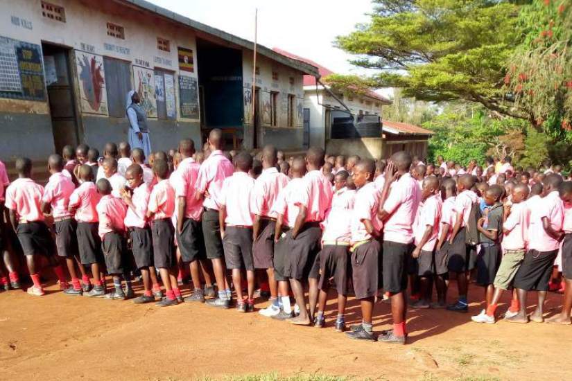 After graduating with a BA in Education through the HESA program, Sr. Betty's congregational superiors appointed her as a Head teacher of St. Matia Mulumba, Kiganda RC Primary. Here she is addressing the pupils at her school.