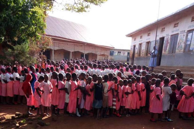 Sr. Betty, Head Teacher at St. Matia Mulumba Kiganda RC Primary, addresses her pupils. St. Matia is a government-aided primary school in Kiyinda-Mityana Diocese, Mubende District in Uganda.