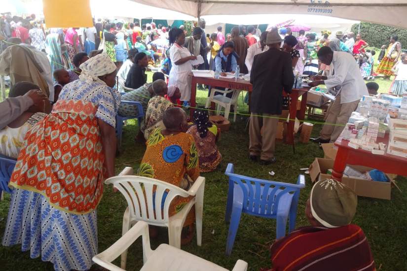 Large groups of people gathered for the free medical camp held in the rural village of Nyabwina, Uganda.