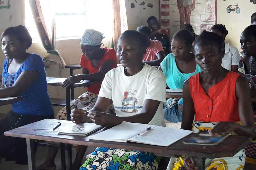 Sr. Judith Mwango with students from the adult literacy class, consisting of 34 adults not ashamed to go back to school to attain an education.