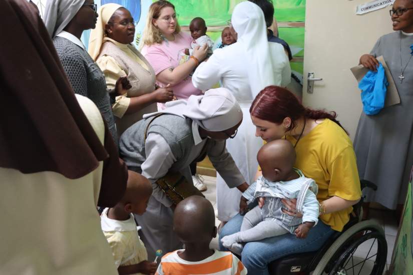 Madilyn Grose with children at Cottolengo Home for Orphaned children in Kenya.