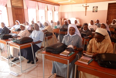 Students receiving their books laptops